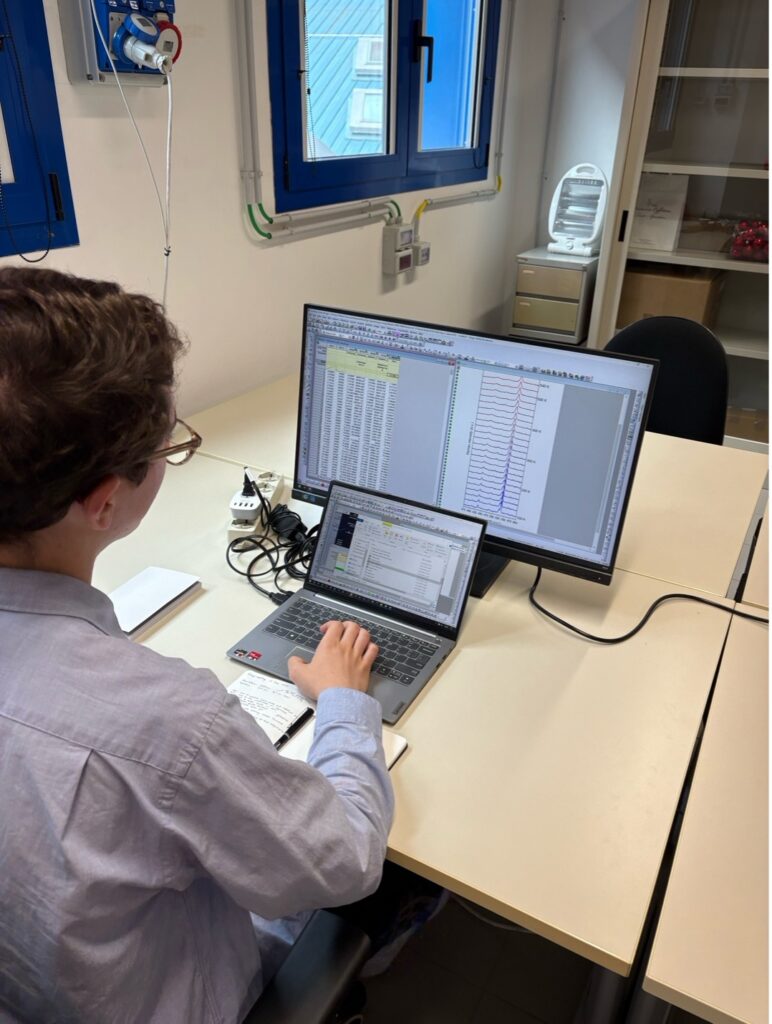 Guy plotting data at computer